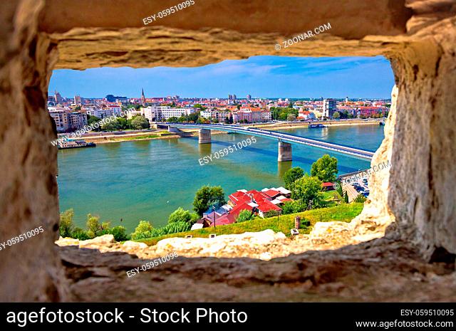City Of Novi Sad and Danube river aerial view through stone window from Petrovaradin, Vojvodina region of Serbia