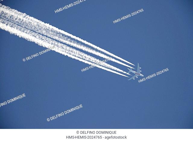 France, Doubs, long haul aircraft with four engines in the open blue sky leaving a white trail behind him important