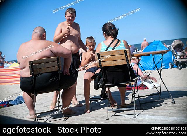 Poland, Wladyslawowo in Pomeranian province 14.08.2015. The couple with two children in front of a beach bar. Photo CTK/Grzegorz Klatka
