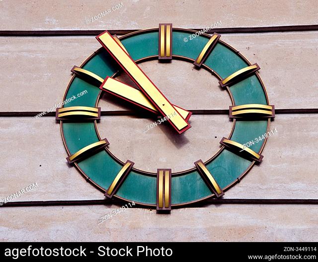 Modernistic clock on the wall of industrial building. Time passing