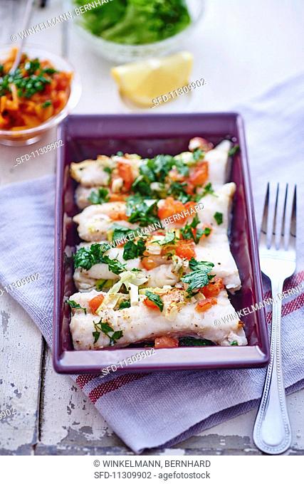 Pollack fillets with tomatoes and parsley