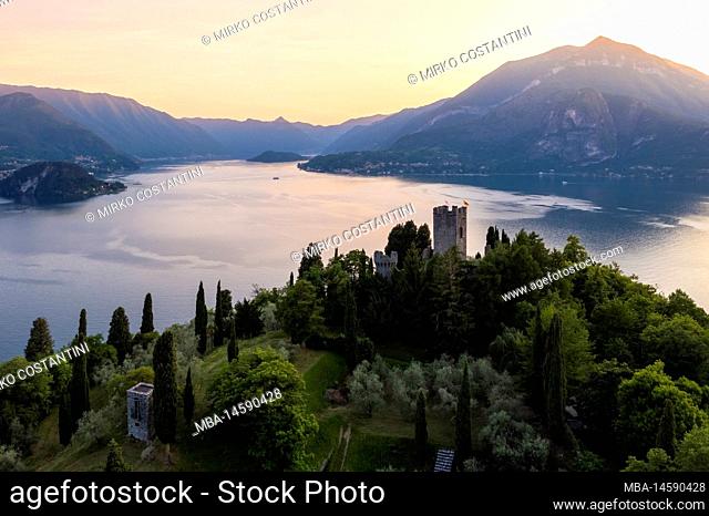 Aerial view of the castle of Vezio, dominating lake Como and Varenna town at sunset. Vezio, Perledo, Lecco district, Lombardy, Italy, Europe
