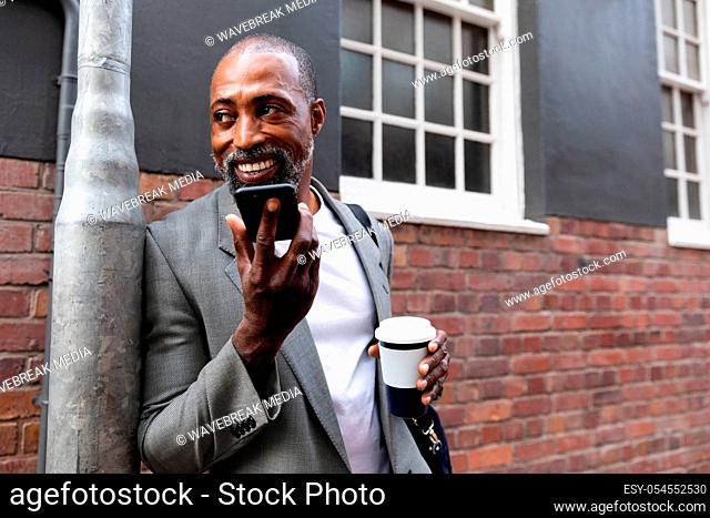 African American man having a phone call in the street
