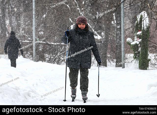 RUSSIA, MOSCOW - FEBRUARY 19, 2023: A woman skis in the snow in Severnoye Tushino Park in a northwest suburb of Moscow in winter. Sergei Bobylev/TASS