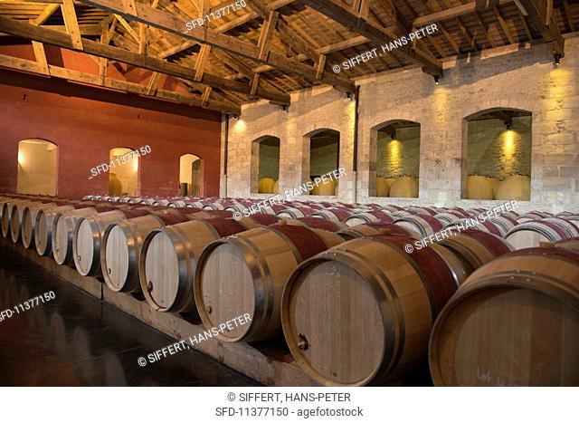 Wooden barrels and amphorae in the cellar at Chateau Pontet-Canet (Bordeaux, France)