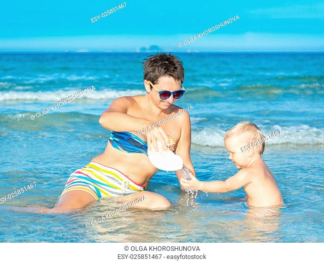 Baby and mother in a sea