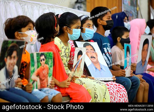 Children hold pictures of their relatives missing during the International Day of the Victims of Enforced Disappearances on August 30th 2021 in Dhaka