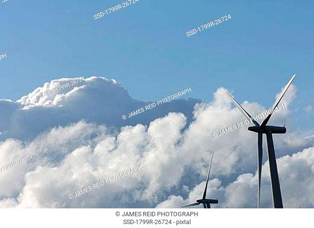 Wind turbines with clouds in the sky