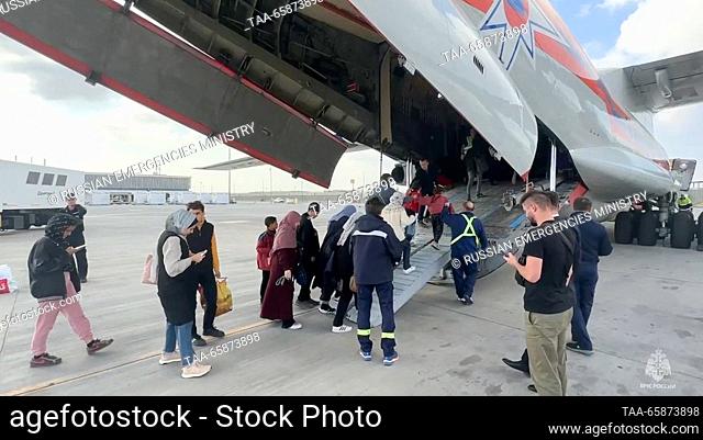 EGYPT, CAIRO - DECEMBER 18, 2023: Russian citizens evacuated from the zone of the Israeli-Palestinian conflict are seen by an Ilyushin Il-76 plane of the...