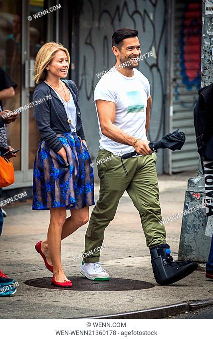 Kelly Ripa and Mark Consuelos were all smiles in spite of wet weather as they were spotted strolling through SoHo Featuring: Kelly Ripa