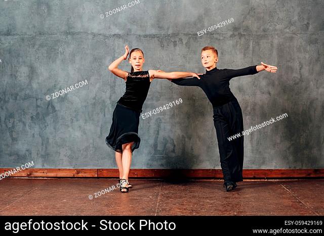 Young couple boy and girl dancing in ballroom dance Jive