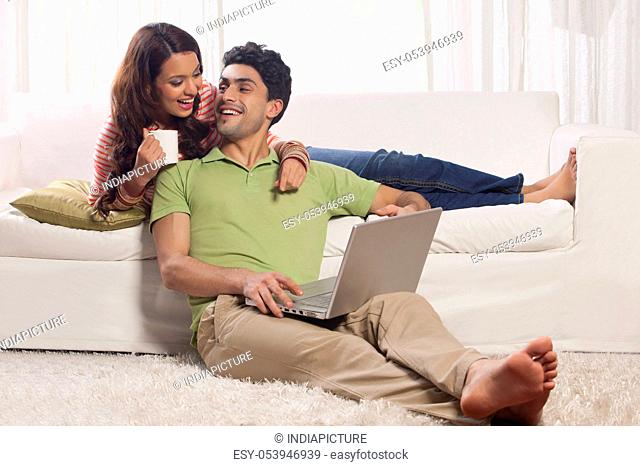 Married couple with a laptop