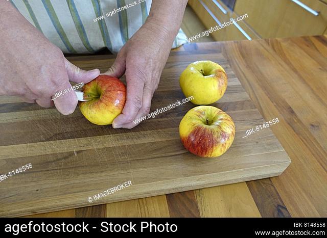 Swabian cuisine, preparation apple fritters, peel apple, fruit for dessert, dessert, dessert, men's hands, knife, Germany, Europe
