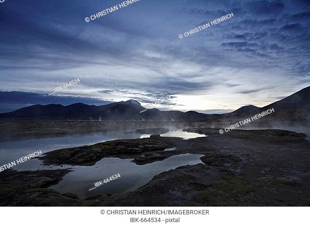 Natural thermal springs Polloquere at dawn, salt lake Salar de Surire, national park Reserva Nacional Las Vicunas, Chile, South America