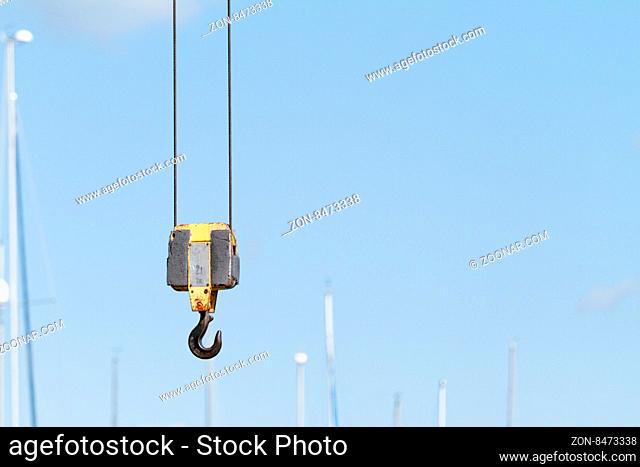 Photo of a crane hook on the blue skay
