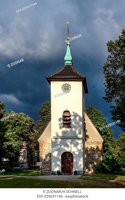 Thunderclouds over the village church in Berlin-Reinickendorf