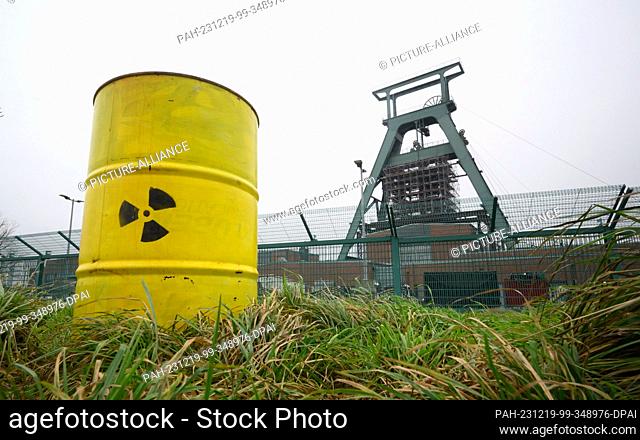 19 December 2023, Lower Saxony, Salzgitter: A barrel with a nuclear sign painted on it stands as a protest action at the site of the Konrad mine
