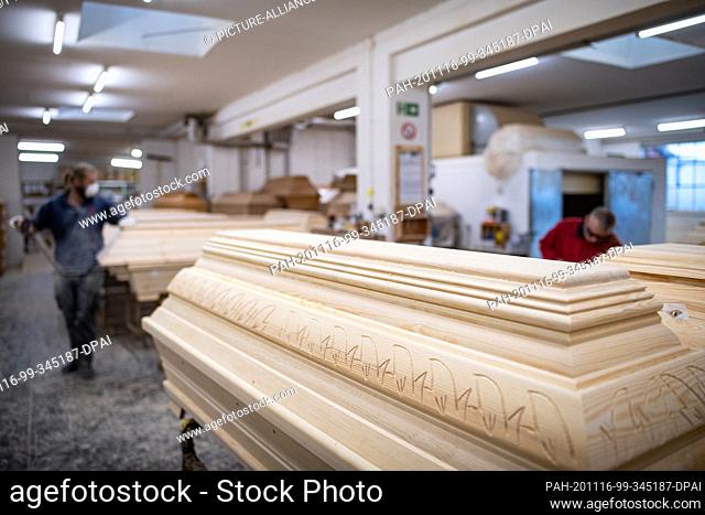 12 November 2020, Lower Saxony, Glandorf: A coffin with carved ornaments stands in the production hall of a coffin manufacturer