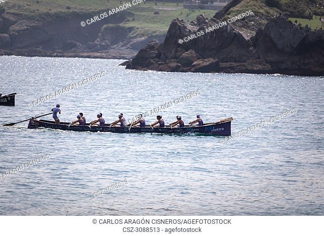 CASTRO URDIALES, SPAIN - JULY 15, 2018: Competition of boats, regata of trainera, San Pedro boat in action in the VI Bandera CaixaBank competition