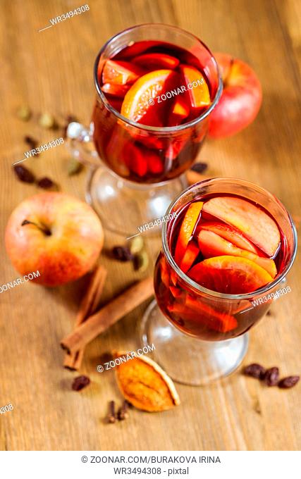 Christmas mulled wine with apple cider, fruits and spices
