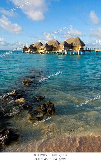 Stilt houses at a tourist resort on the beach, Tikehau Pearl Beach Resort, Tikehau, Tuamotu Archipelago, French Polynesia