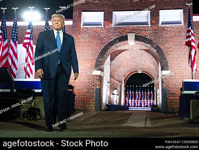 United States President Donald J. Trump arrives as US Vice President Mike Pence delivers remarks on the third night of the Republican Nationals Convention at Ft