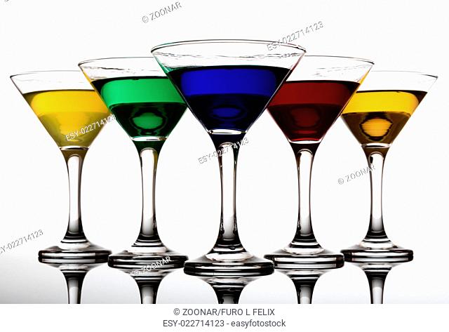 color cocktails in martini glasses
