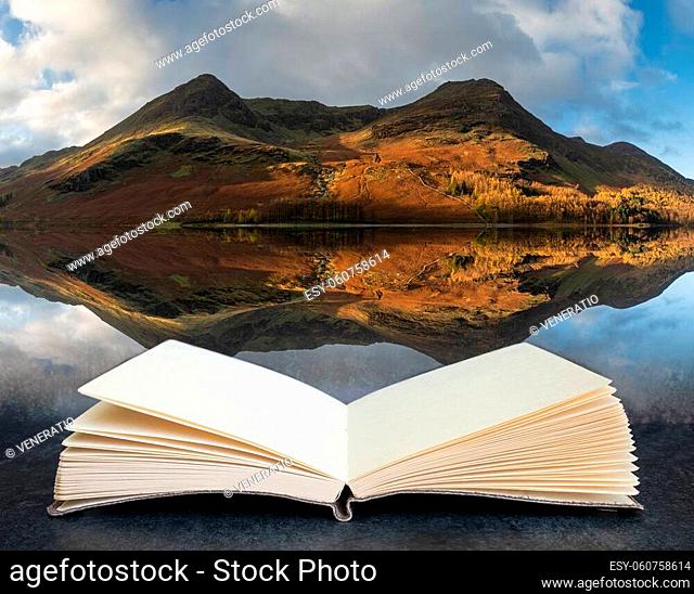 Stunning epic Autumn Fall landscape Buttermere in Lake District with beautiful early morning sunlight playing across the hills and mountains coming out of pages...