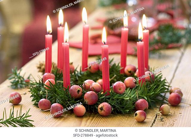 Christmas yew wreath with ornamental apples & 8 red candles Not available for postcards