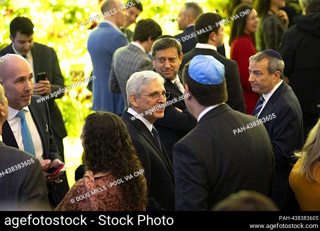 United States Attorney General Merrick Garland is seen speaking to guest as President Joe Biden host a Hanukkah Holiday Reception in the East Room of the White...