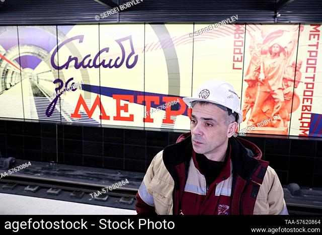 RUSSIA, MOSCOW - MARCH 1, 2023: Worker wearing a hard hat is seen on the newly-opened Sokolniki Station on Line 11 (Big Circle Line) of the Moscow Underground