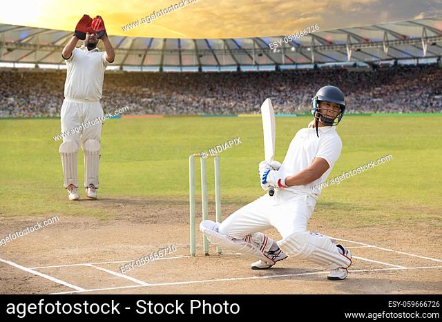 Batsman avoids a bouncer during a match in the stadium