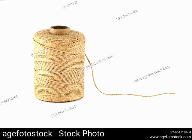 Natural brown twisted jute twine isolated on white background