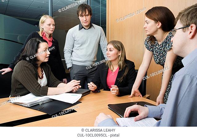 Colleagues meeting in boardroom