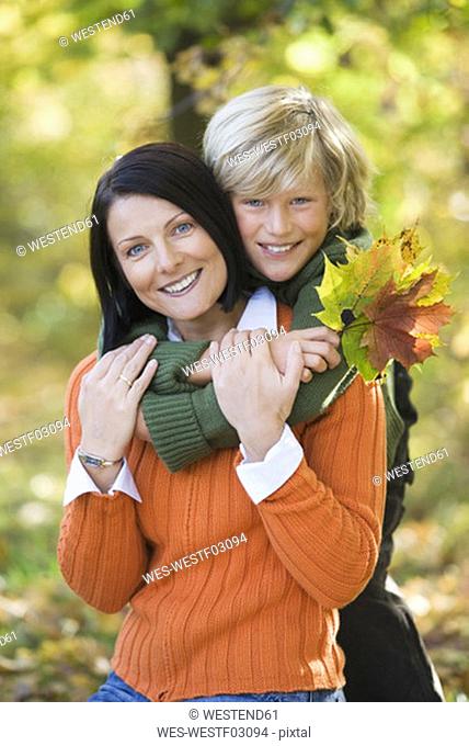 Mother and son embracing, portrait