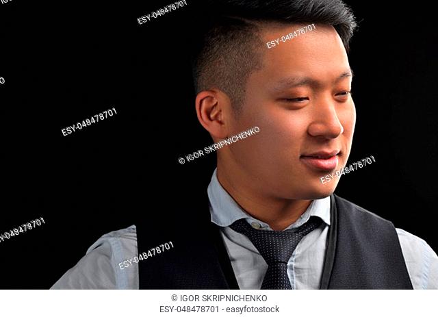 Portrait of an Asian young man in a shirt with a stylish hairstyle