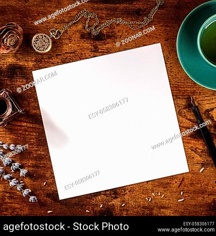 Square stationery mockupor a greeting card or wedding invitation, shot from above with copy space