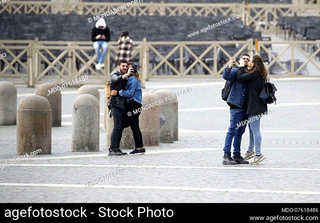 St. Peter's Square during Coronavirus infection (Covid-19). Some couples hug eachother making a selfie. Vatican City, (Vatican), March 6th, 2020