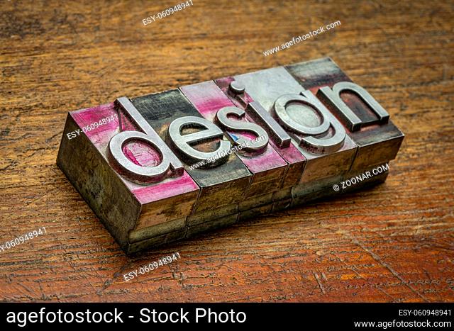 design word abstract in gritty vintage letterpress metal type stained by printing ink against rustic wood, art, business and industry concept