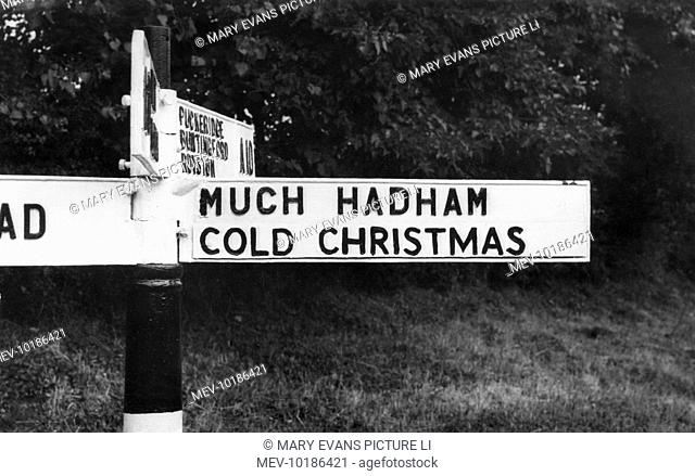 An amusing signpost for the villages of 'Much Hadham' and 'Cold Christmas' in Hertfordshire, England!