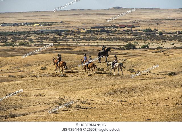 Group Of People Horseback Riding Trails At Swakopmund In Namibia