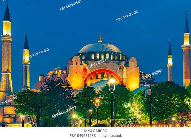Hagia Sophia in Istanbul, Turkey early in the night with beautiful trees and lights