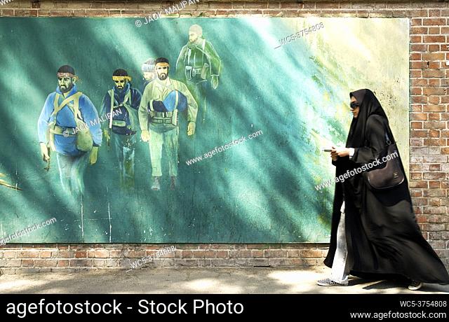 veiled woman in teheran iran street