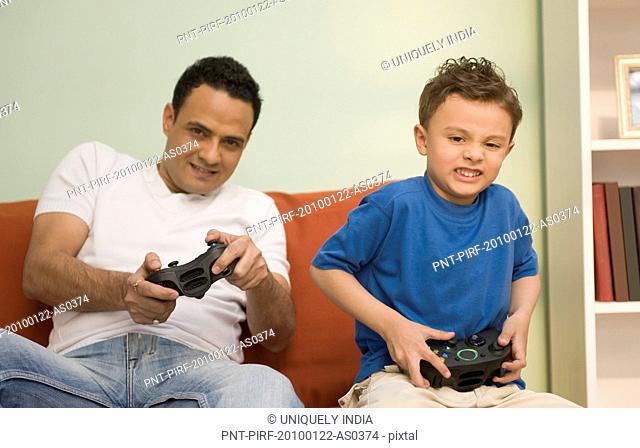 Man and his son playing a video game