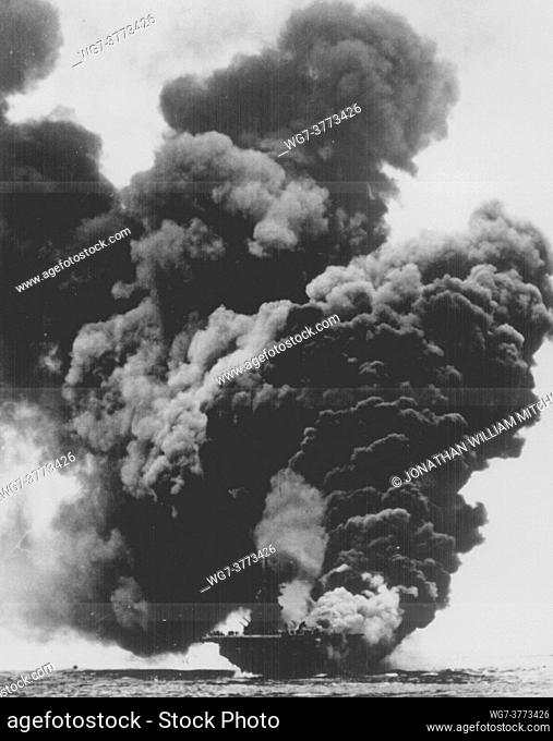 PACIFIC OCEAN Okinawa -- 11 May 1945 -- The aircraft carrier USS BUNKER HILL burning after Japanese suicide attack -- Picture by Lightroom Photos / US Navy...