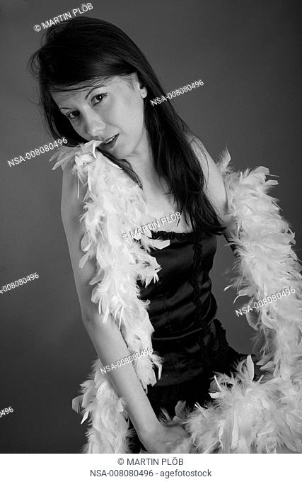 young woman with feather boa