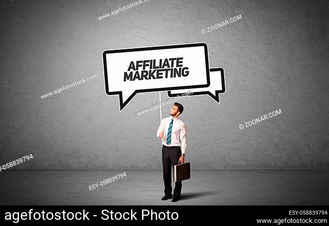 Young business person in casual holding road sign with AFFILIATE MARKETING inscription, new business idea concept