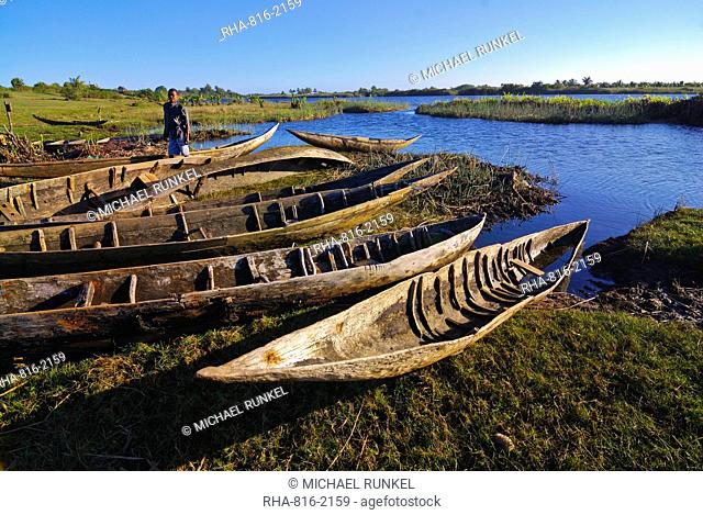 Canoes by the Manakara River, part of the Pangalanes Canal system, Manakara, Madagascar, Indian Ocean, Africa