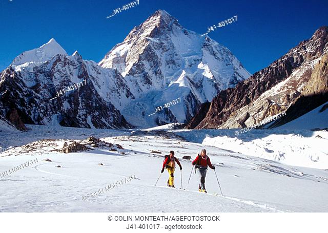Skiers return from base of K2, Godwin-Austen glacier in spring. Karakoram mountains, Pakistan