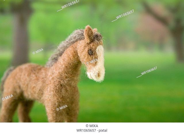 Felt Toy Horse on Printed Background Paper